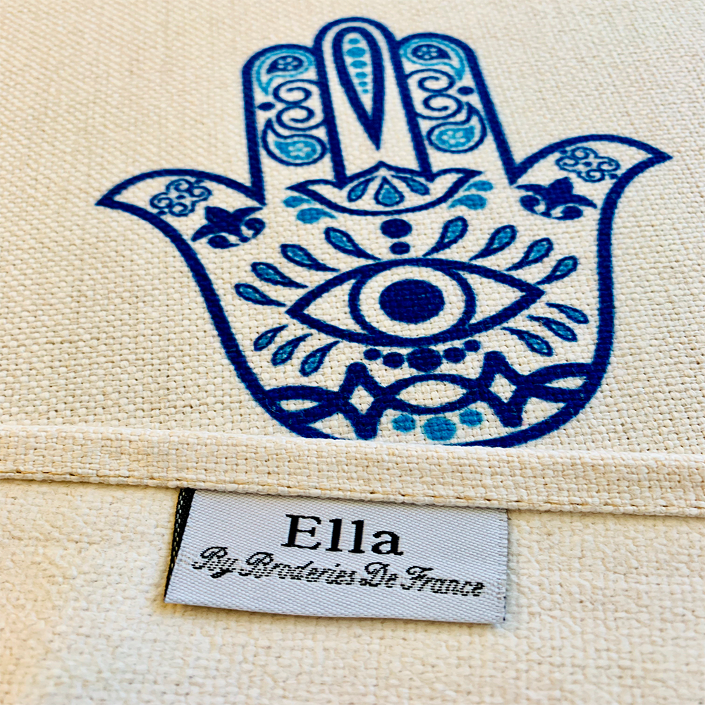 Blue Hamsa Tablecloth featuring an original Ella design by Broderies de France, showcasing a blue-eyed Hamsa symbol.