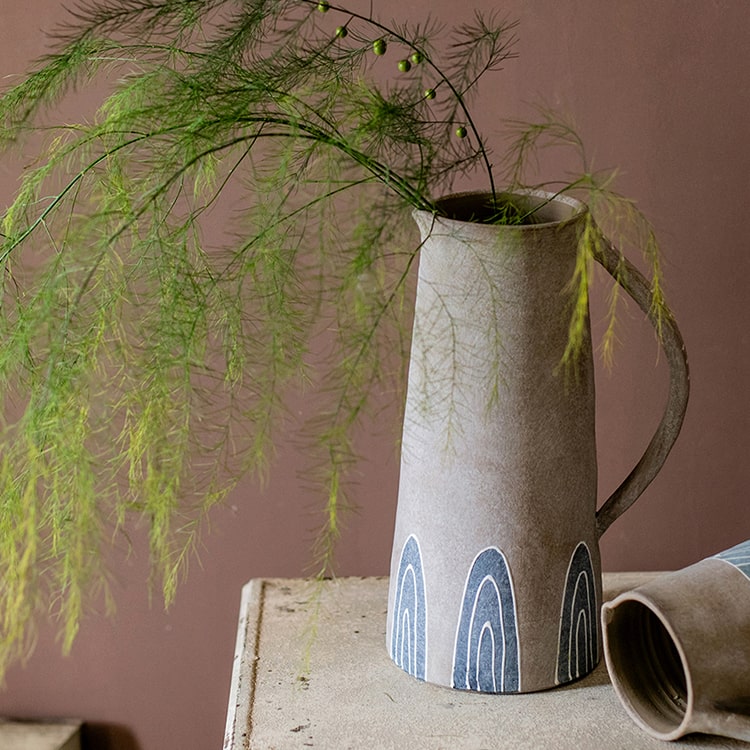 A beautifully handpainted blue terracotta vase jar with intricate designs, showcasing its unique colors and craftsmanship.