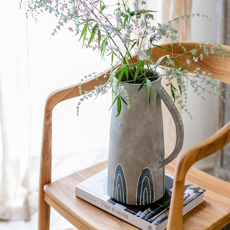 A beautifully handpainted blue terracotta vase jar with intricate designs, showcasing its unique colors and craftsmanship.