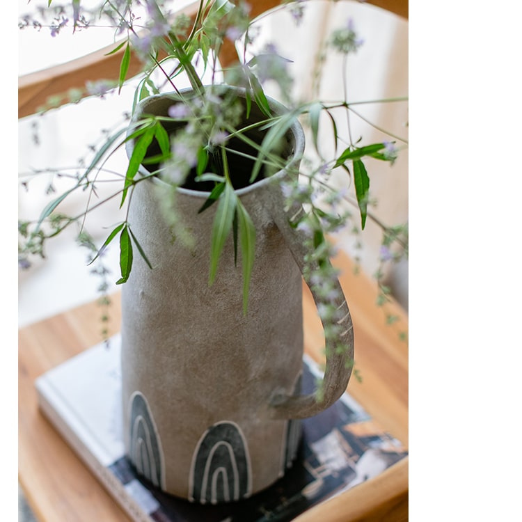 A beautifully handpainted blue terracotta vase jar with intricate designs, showcasing its unique colors and craftsmanship.