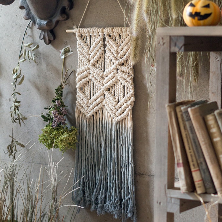 Handmade Blue Tassel Tapestry featuring cotton rope and wooden stick, showcasing a blend of blue, beige, and white colors.