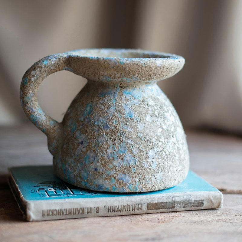 A beautifully handcrafted blue terracotta table vase, showcasing unique colors and design, perfect for home decor.