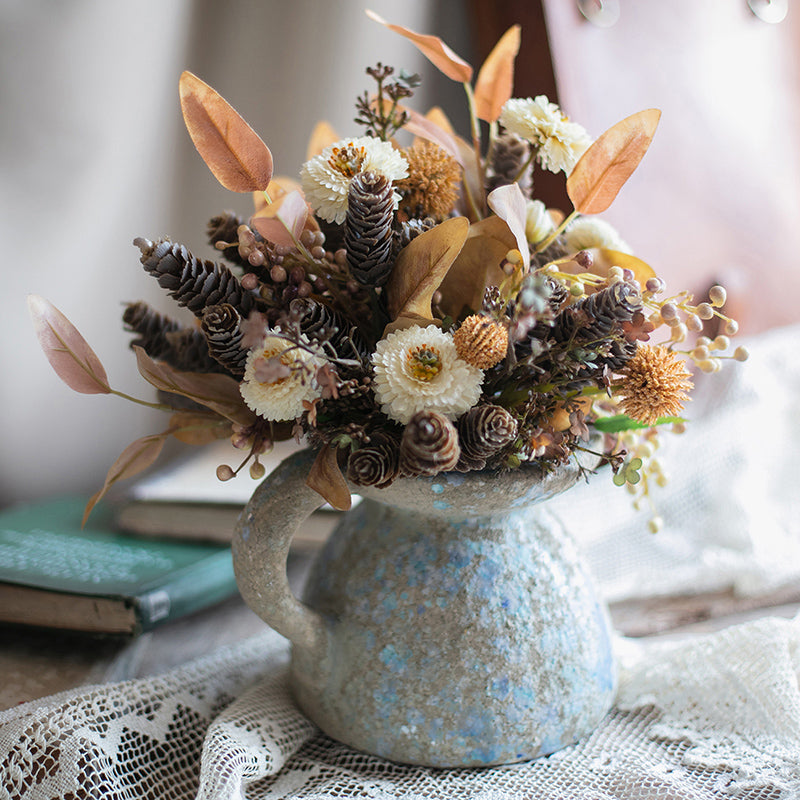 A beautifully handcrafted blue terracotta table vase, showcasing unique colors and design, perfect for home decor.