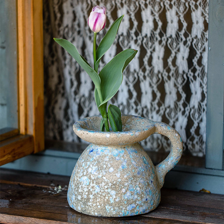 A beautifully handcrafted blue terracotta table vase, showcasing unique colors and design, perfect for home decor.