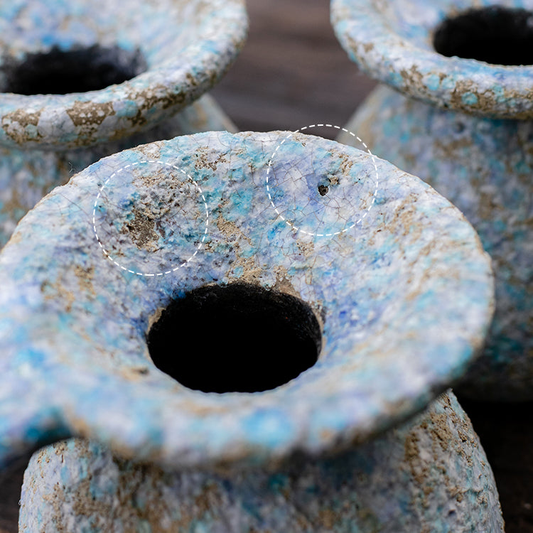 A beautifully handcrafted blue terracotta table vase, showcasing unique colors and design, perfect for home decor.