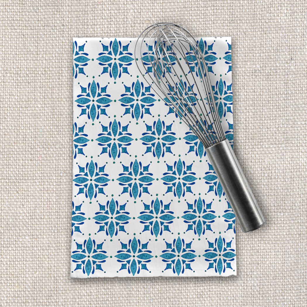 A blue tile patterned tea towel made of cotton twill, measuring 18x30 inches, showcasing a cozy kitchen decor style.