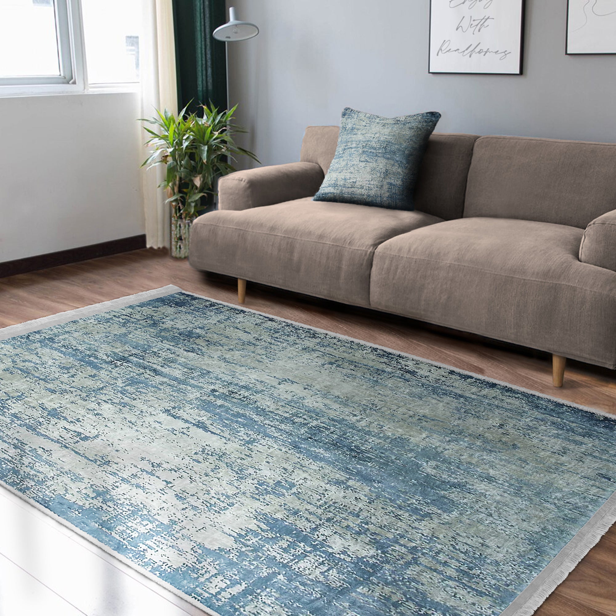 Blue Washable Area Rug by Homeezone featuring a stylish blue pattern and fringes, perfect for any room.