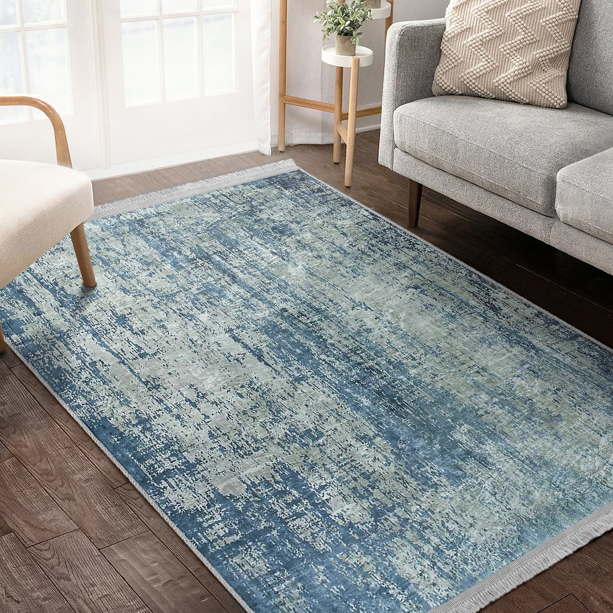 Blue Washable Area Rug by Homeezone featuring a stylish blue pattern and fringes, perfect for any room.