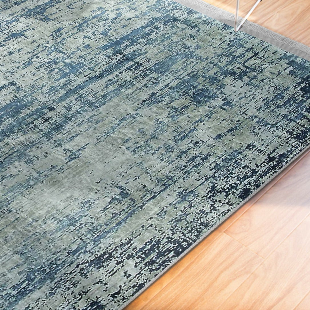 Blue Washable Area Rug by Homeezone featuring a stylish blue pattern and fringes, perfect for any room.