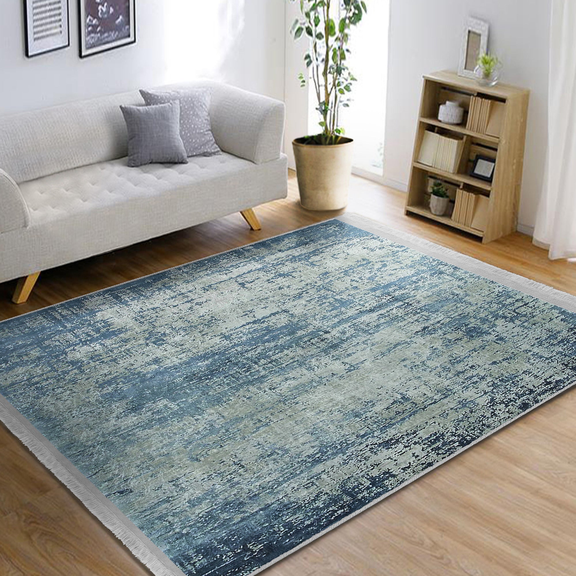 Blue Washable Area Rug by Homeezone featuring a stylish blue pattern and fringes, perfect for any room.