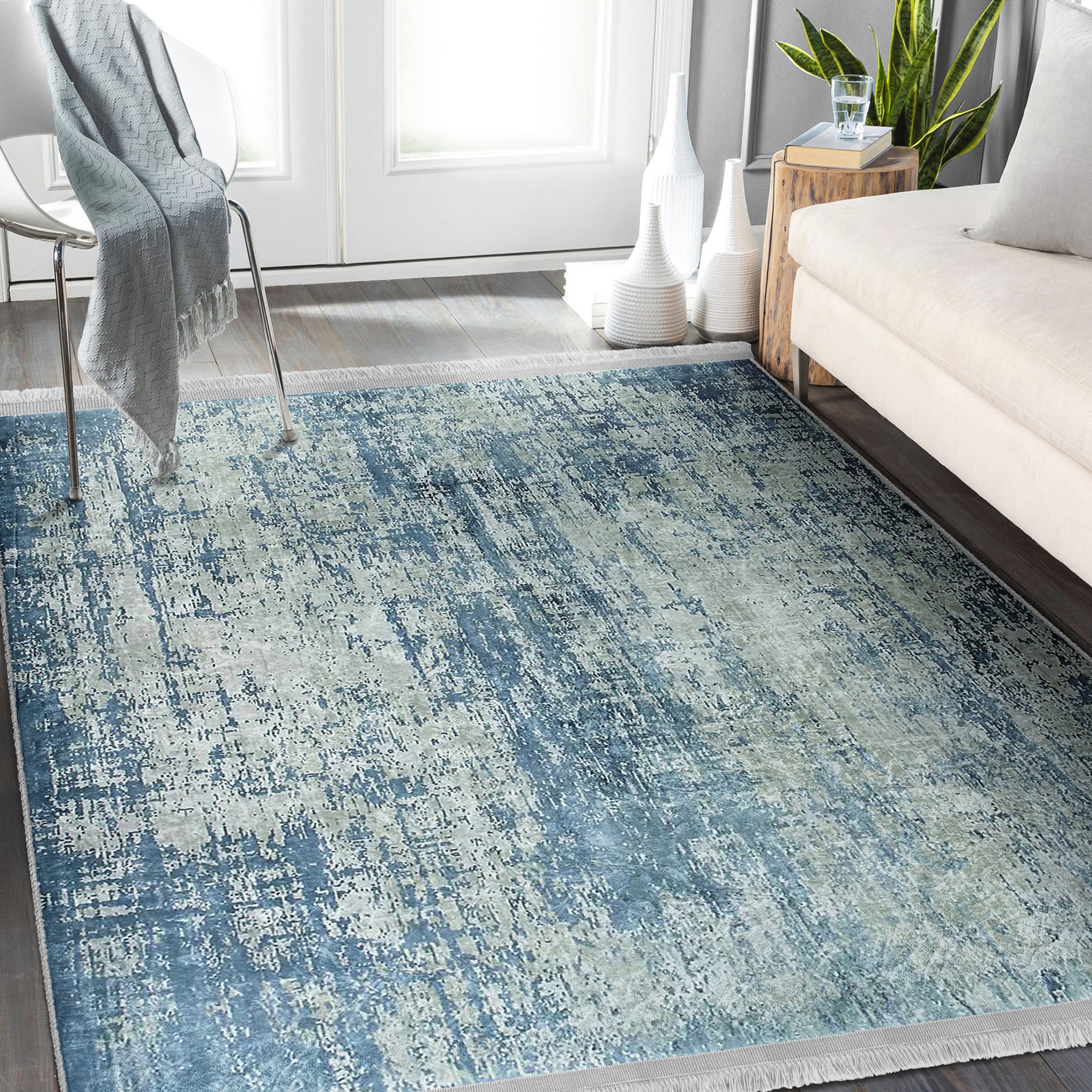 Blue Washable Area Rug by Homeezone featuring a stylish blue pattern and fringes, perfect for any room.