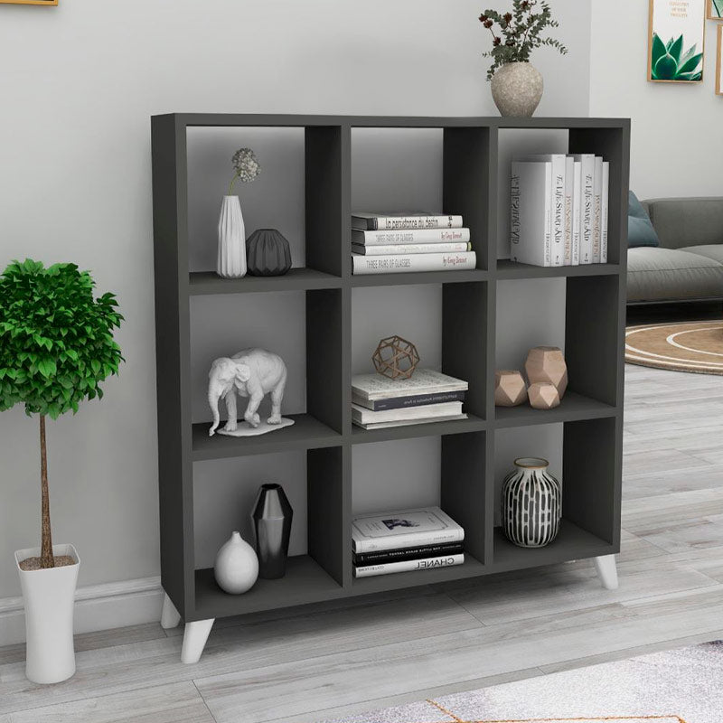 Modern anthracite bookcase CLARISSA with cube-style design, showcasing its sleek shelves and sturdy white legs.