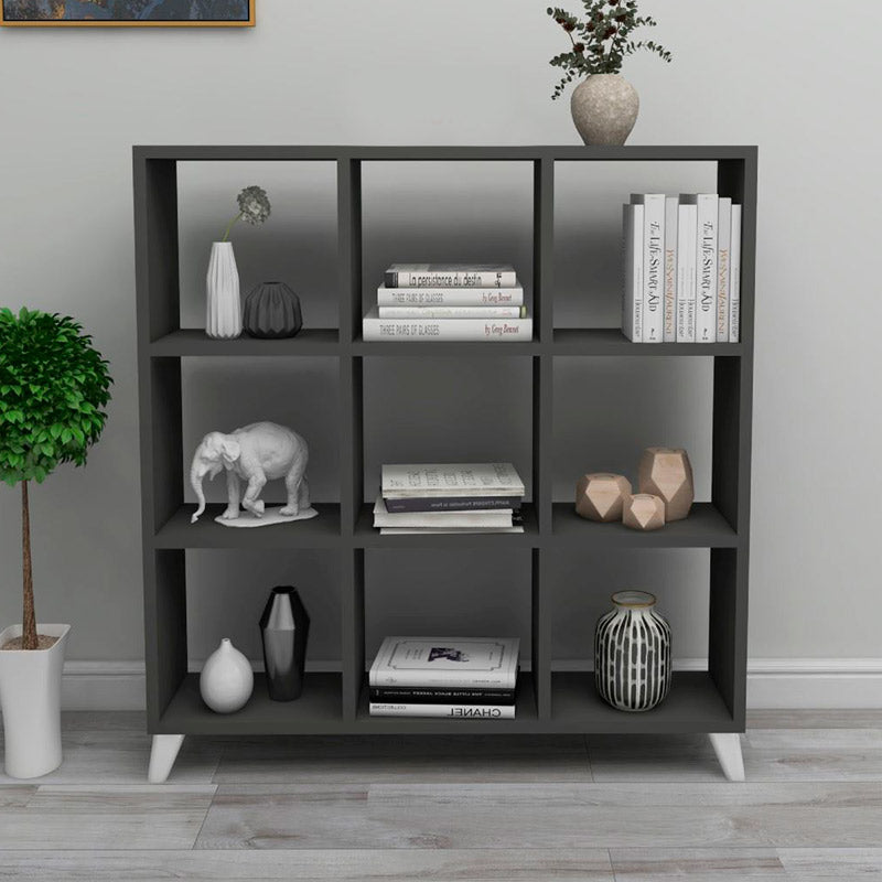 Modern anthracite bookcase CLARISSA with cube-style design, showcasing its sleek shelves and sturdy white legs.