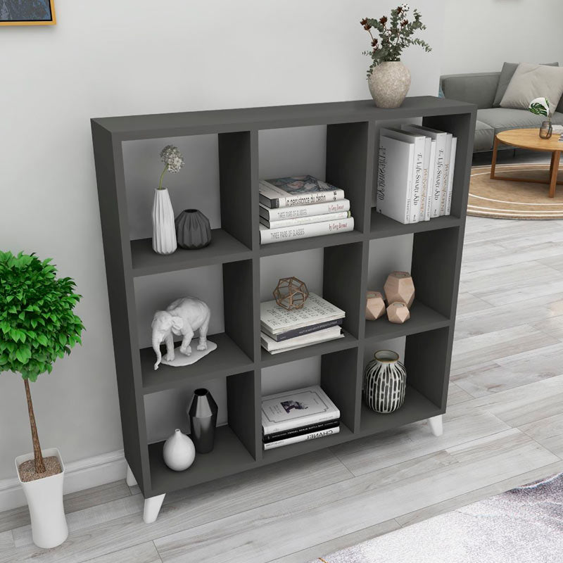 Modern anthracite bookcase CLARISSA with cube-style design, showcasing its sleek shelves and sturdy white legs.