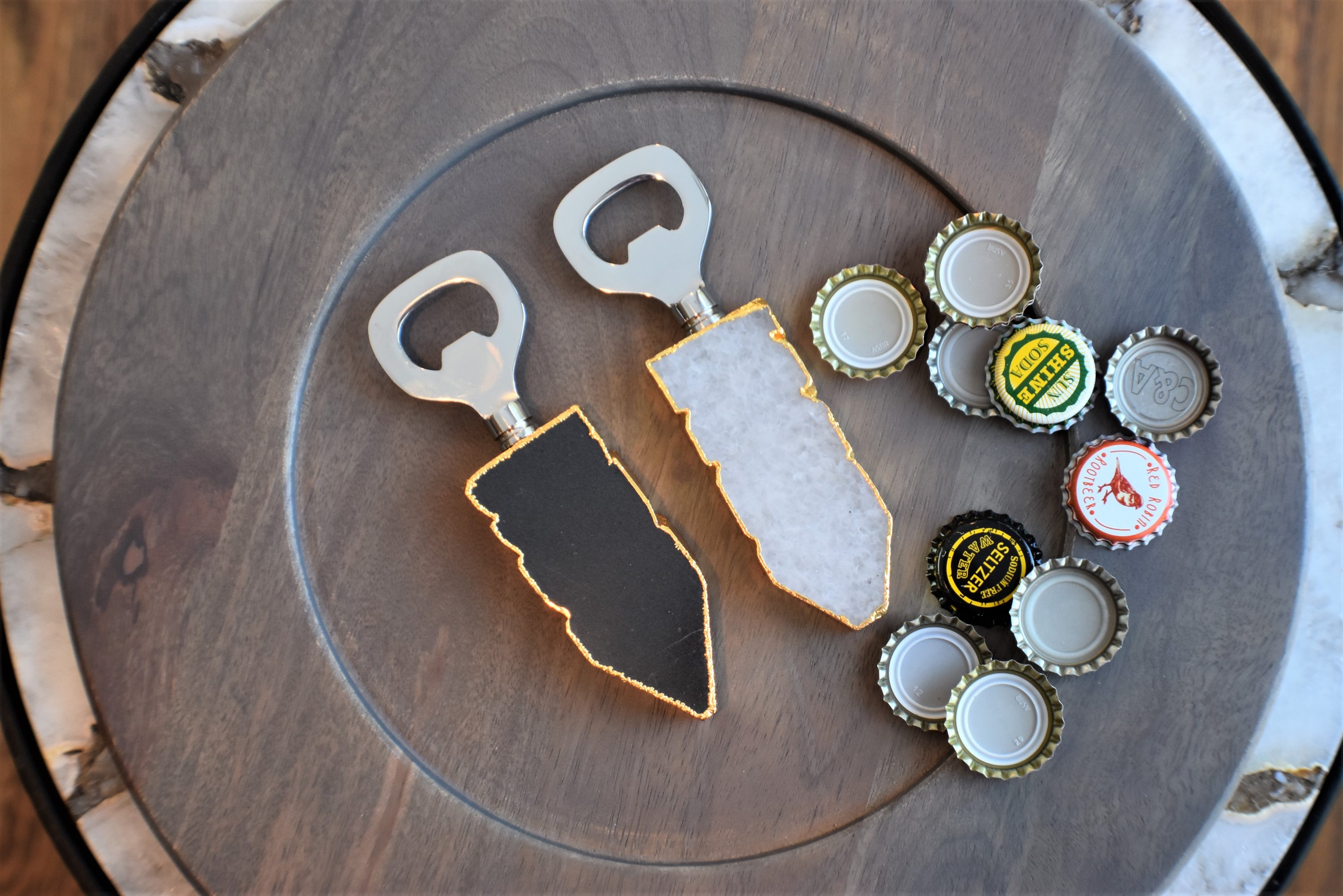 Luxurious bottle opener featuring gold trim and sparkling quartz handle, perfect for elegant entertaining.