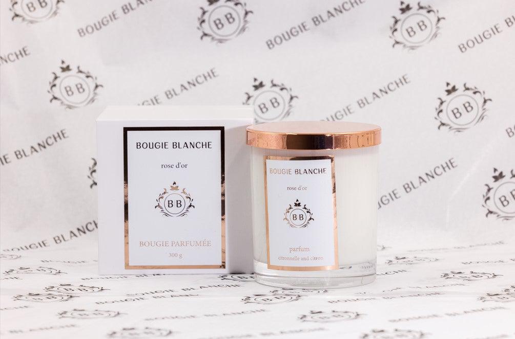 Bougie Blanche Rose d'Or Candle in a stylish jar, showcasing its elegant design and natural soy wax blend.