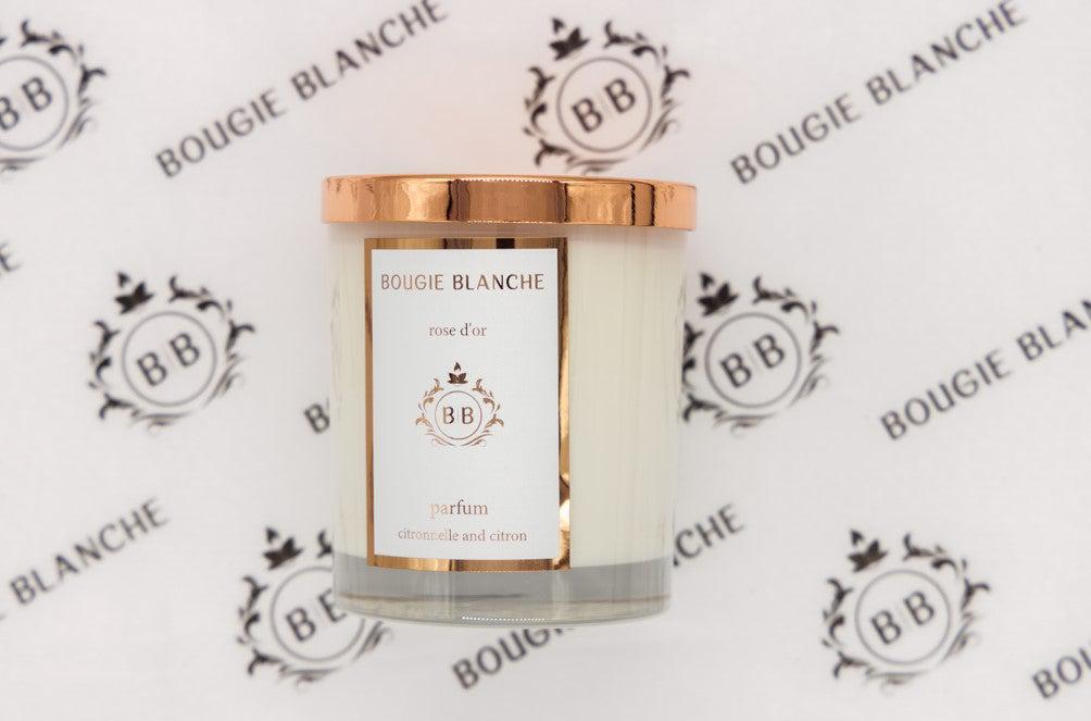 Bougie Blanche Rose d'Or Candle in a stylish jar, showcasing its elegant design and natural soy wax blend.