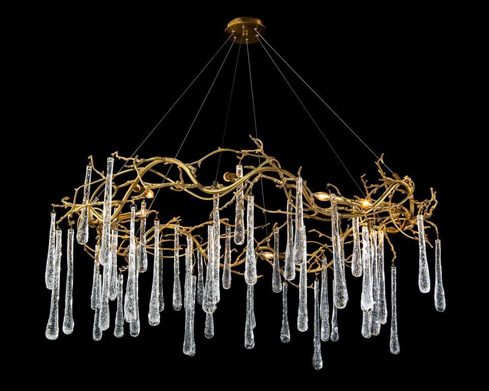 Brass and Glass Teardrop Eight-Light Chandelier featuring elegant brass branches and handblown glass teardrops, perfect for modern interiors.