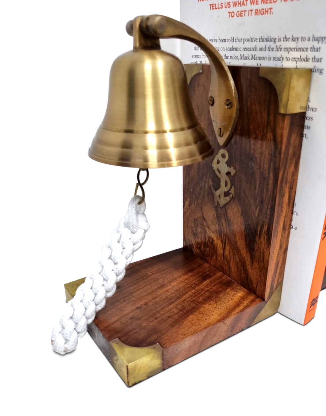 A beautifully handcrafted brass bookend shaped like an anchor bell, featuring an antique finish, perfect for home decor.