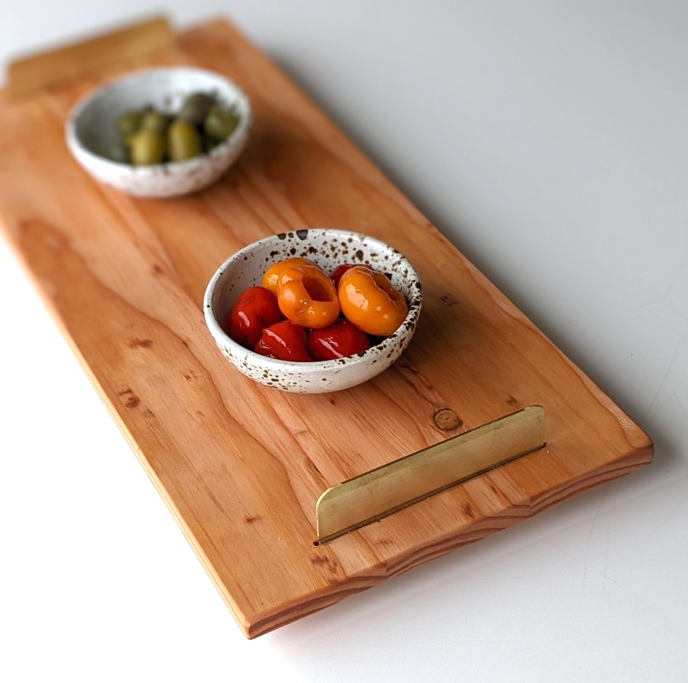 A beautifully crafted Brass Handle Tray made from Doug Fir wood with elegant brass handles, showcasing a unique beeswax finish.