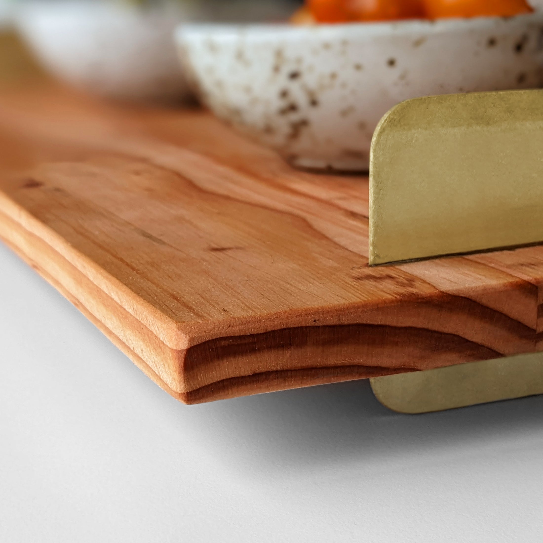 A beautifully crafted Brass Handle Tray made from Doug Fir wood with elegant brass handles, showcasing a unique beeswax finish.