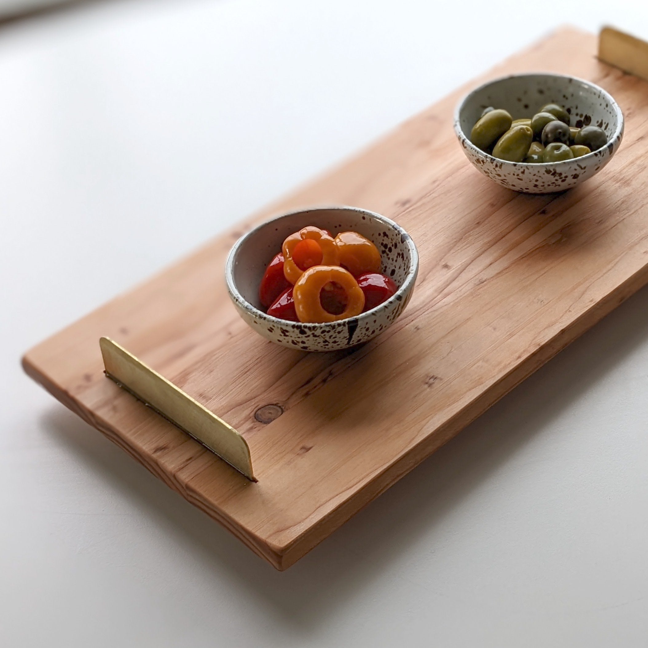 A beautifully crafted Brass Handle Tray made from Doug Fir wood with elegant brass handles, showcasing a unique beeswax finish.