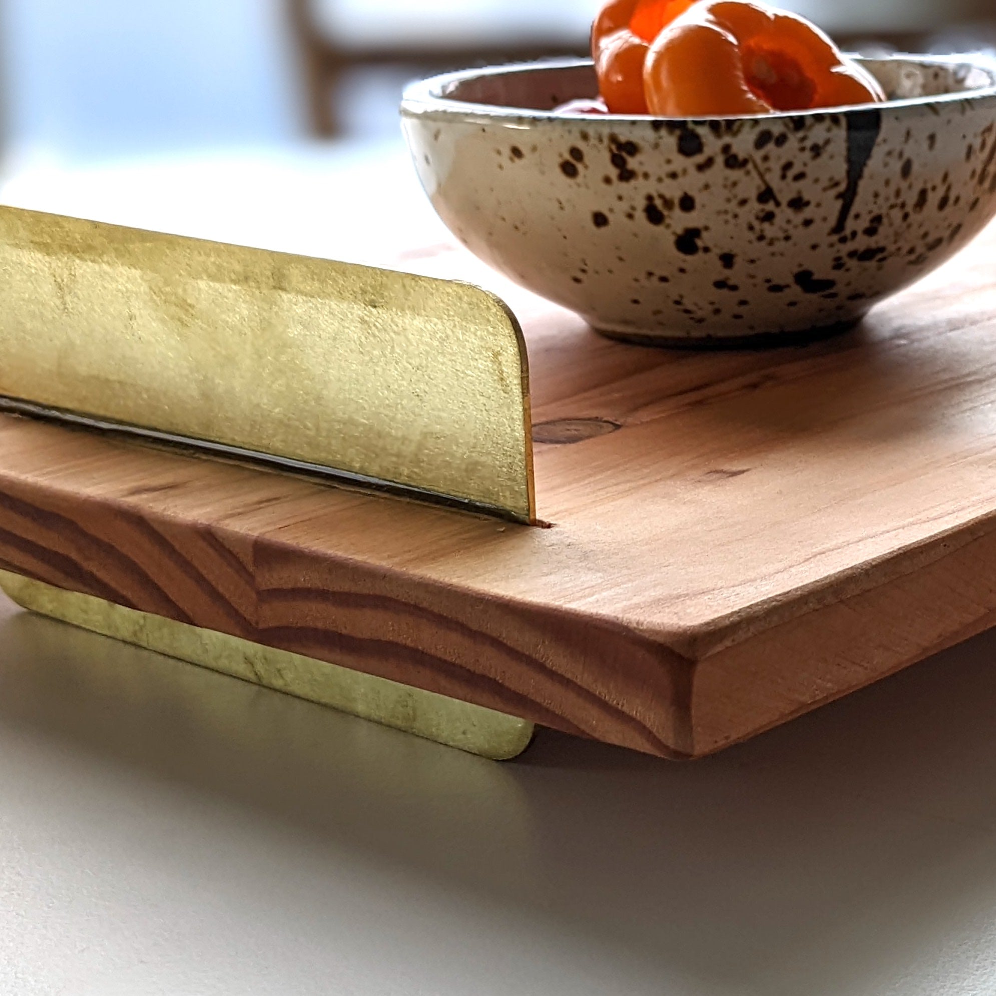 A beautifully crafted Brass Handle Tray made from Doug Fir wood with elegant brass handles, showcasing a unique beeswax finish.