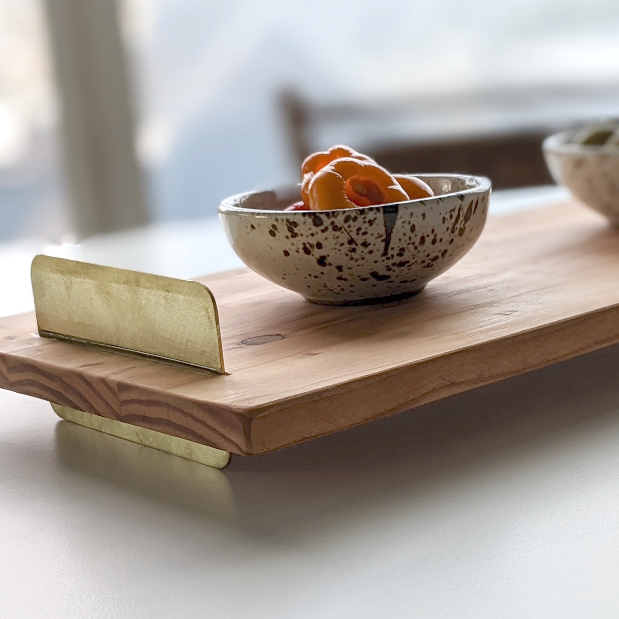 A beautifully crafted Brass Handle Tray made from Doug Fir wood with elegant brass handles, showcasing a unique beeswax finish.