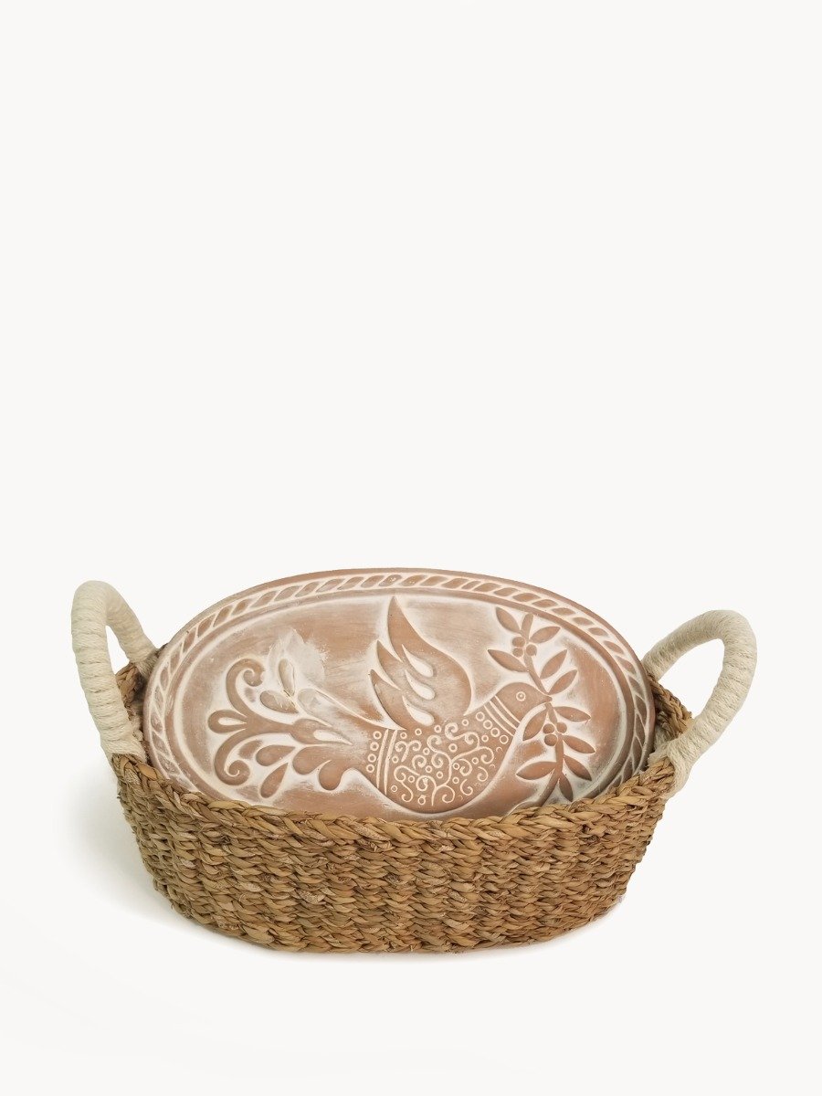 Handcrafted Bird Oval Bread Warmer made of terracotta with a seagrass basket, featuring intricate bird and leaf designs.