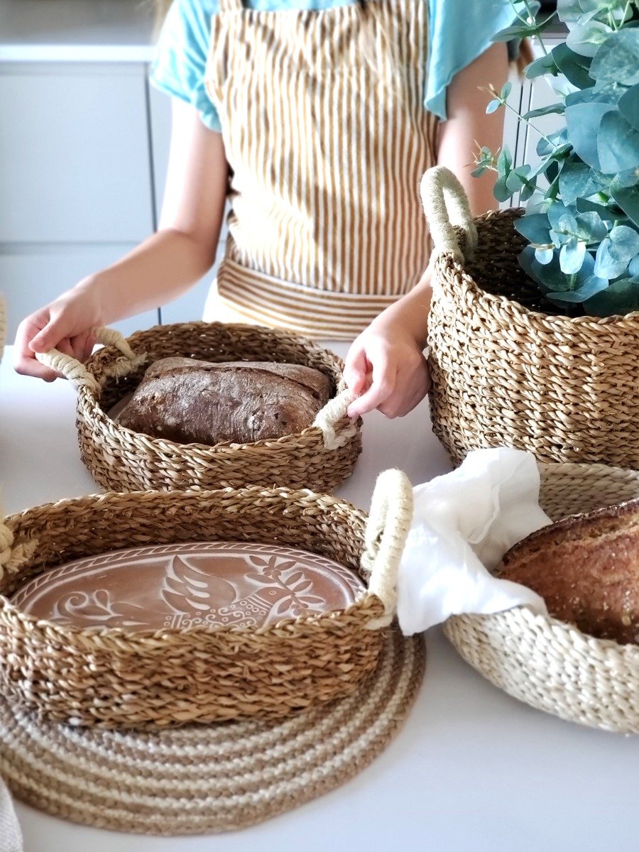 Handcrafted Bird Oval Bread Warmer made of terracotta with a seagrass basket, featuring intricate bird and leaf designs.