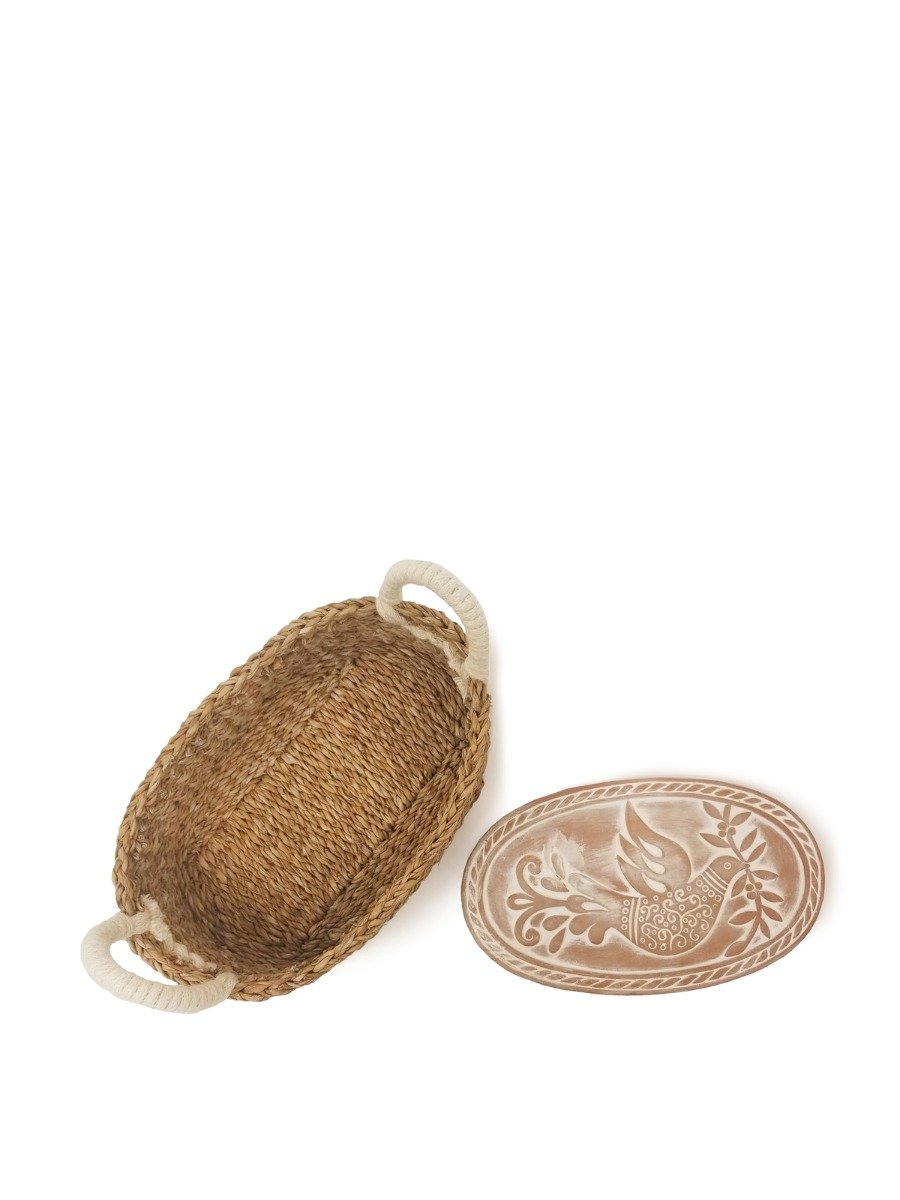 Handcrafted Bird Oval Bread Warmer made of terracotta with a seagrass basket, featuring intricate bird and leaf designs.