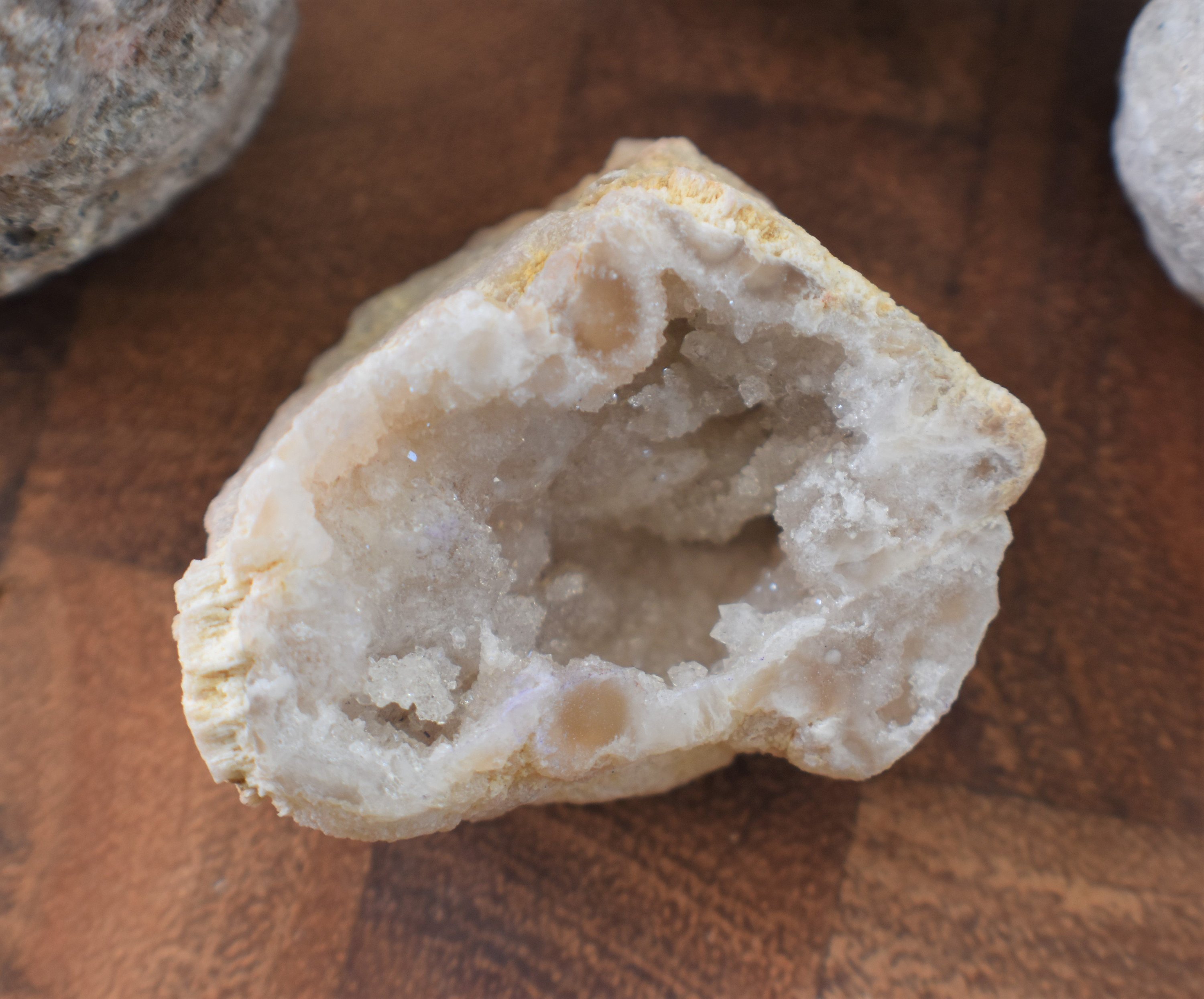 A collection of agate geodes in various sizes, showcasing their spherical shapes and unique textures, ready to be cracked open for exploration.