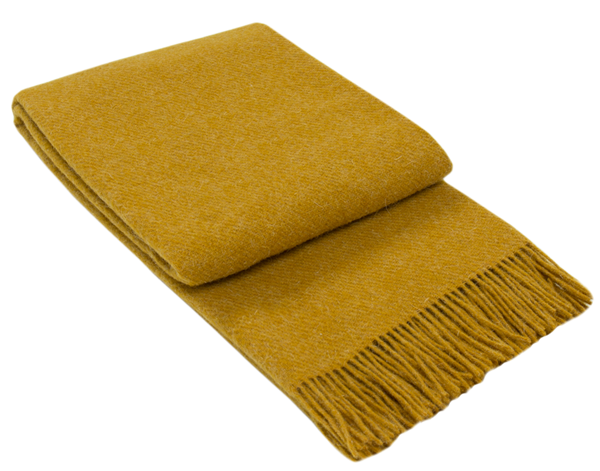 Brighton Throw blanket made from 100% New Zealand wool in mustard color, showcasing its thick and cozy texture.