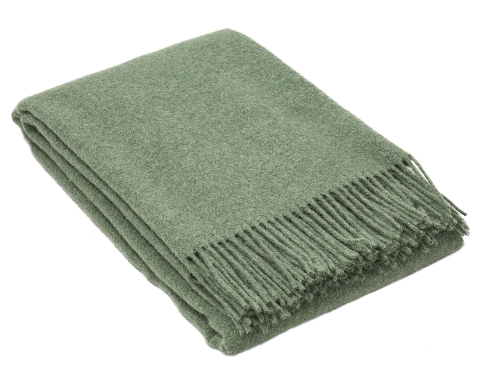 Brighton Throw blanket in sage color, made from 100% New Zealand wool, elegantly draped on a cozy sofa.