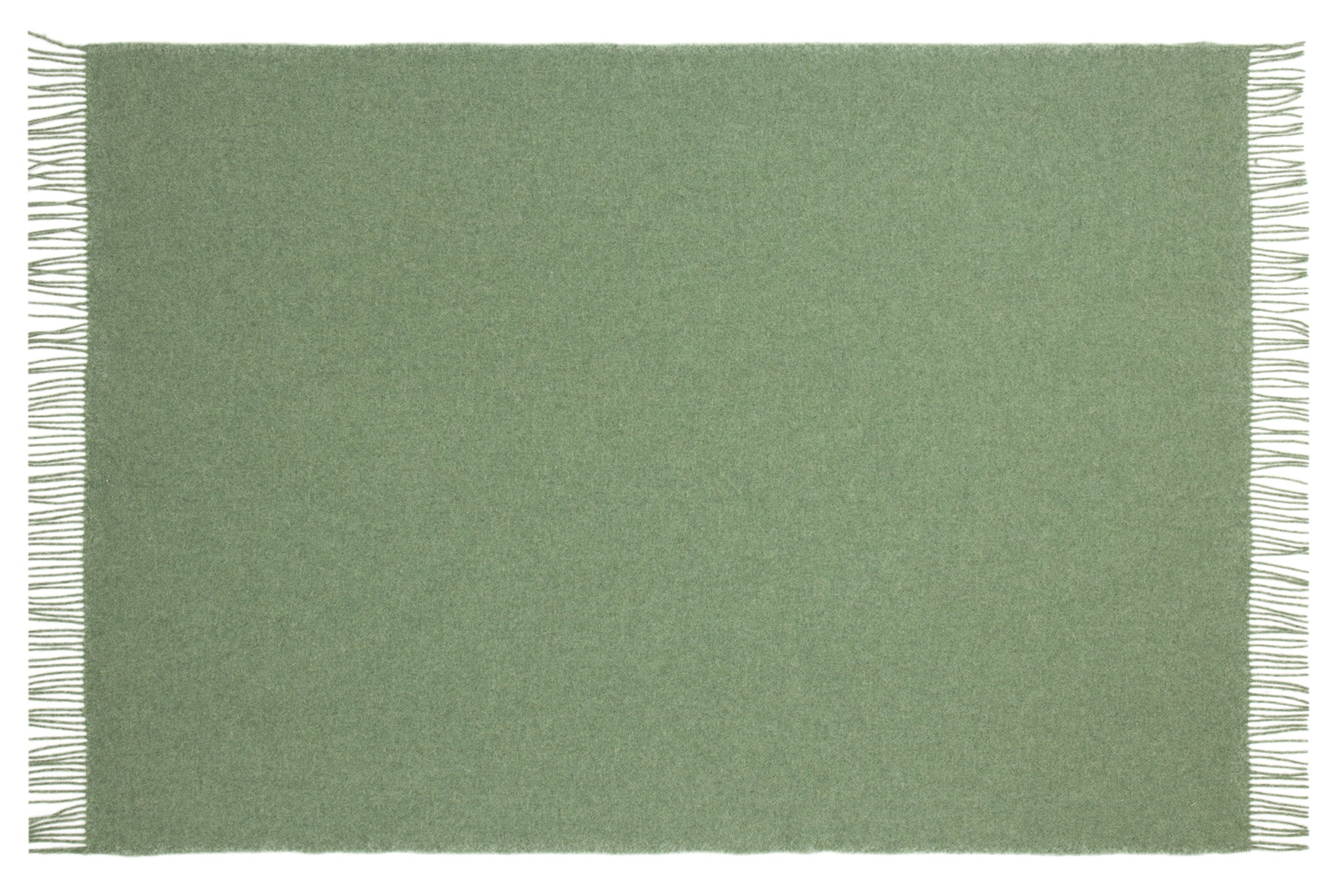 Brighton Throw blanket in sage color, made from 100% New Zealand wool, elegantly draped on a cozy sofa.