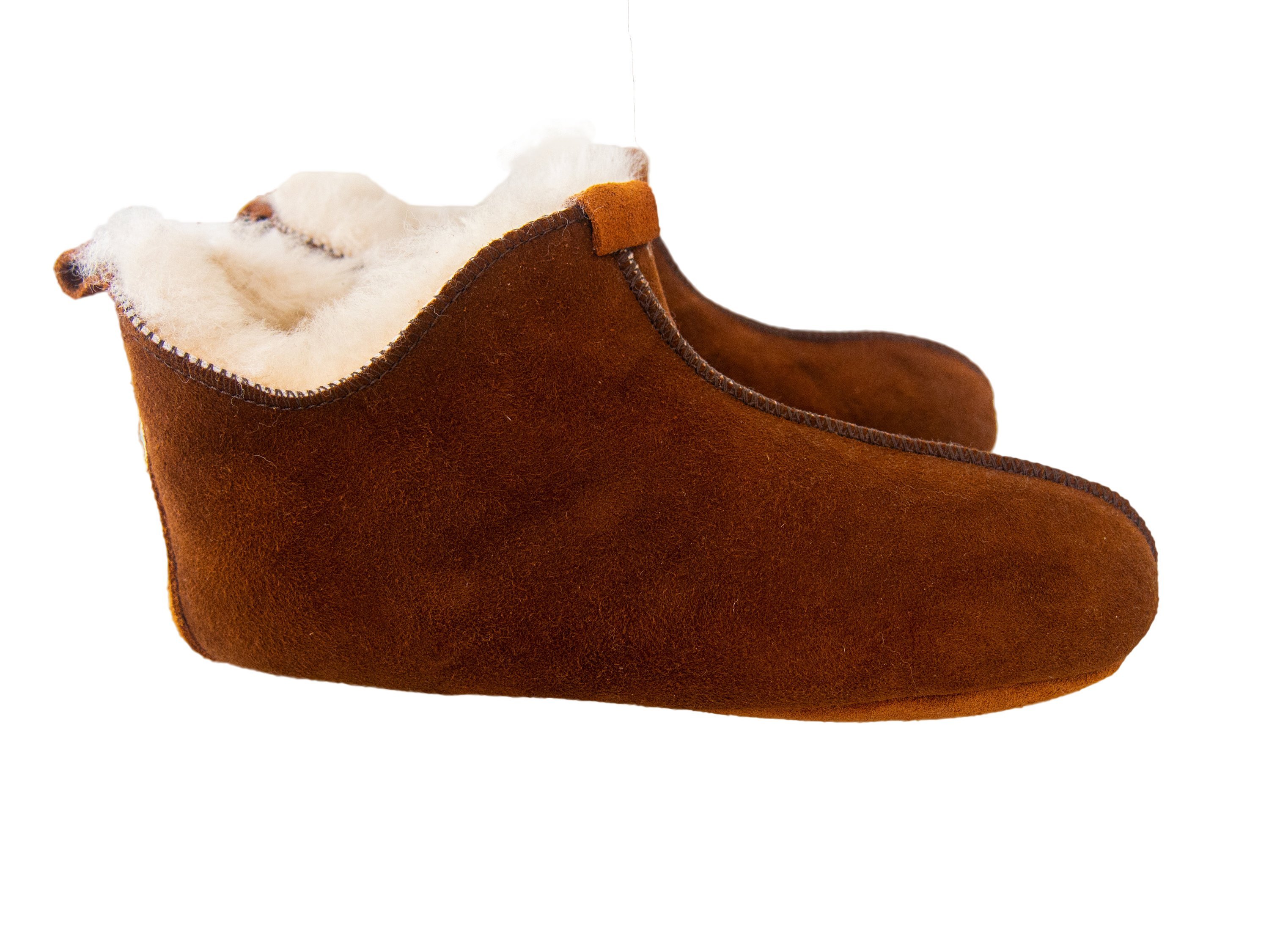 Elegant brown leather slippers with natural fur lining, designed for comfort and durability.