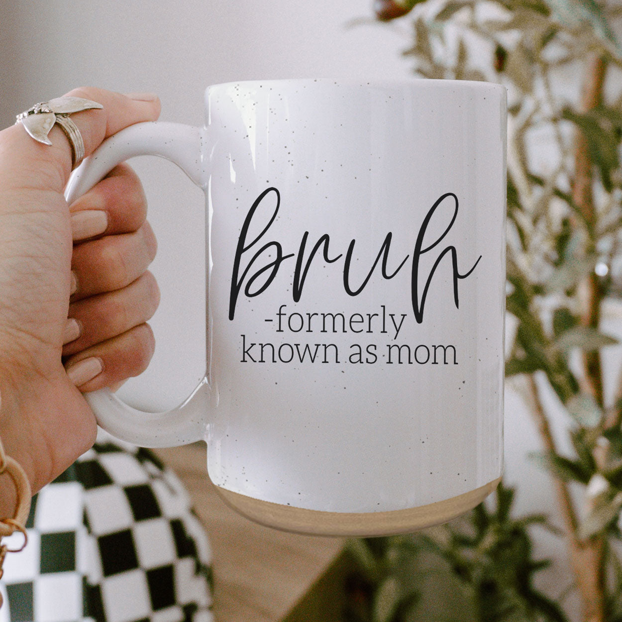 Bruh 16oz ceramic mug with humorous graphic design, off white color with dark speckles, perfect for coffee or tea.