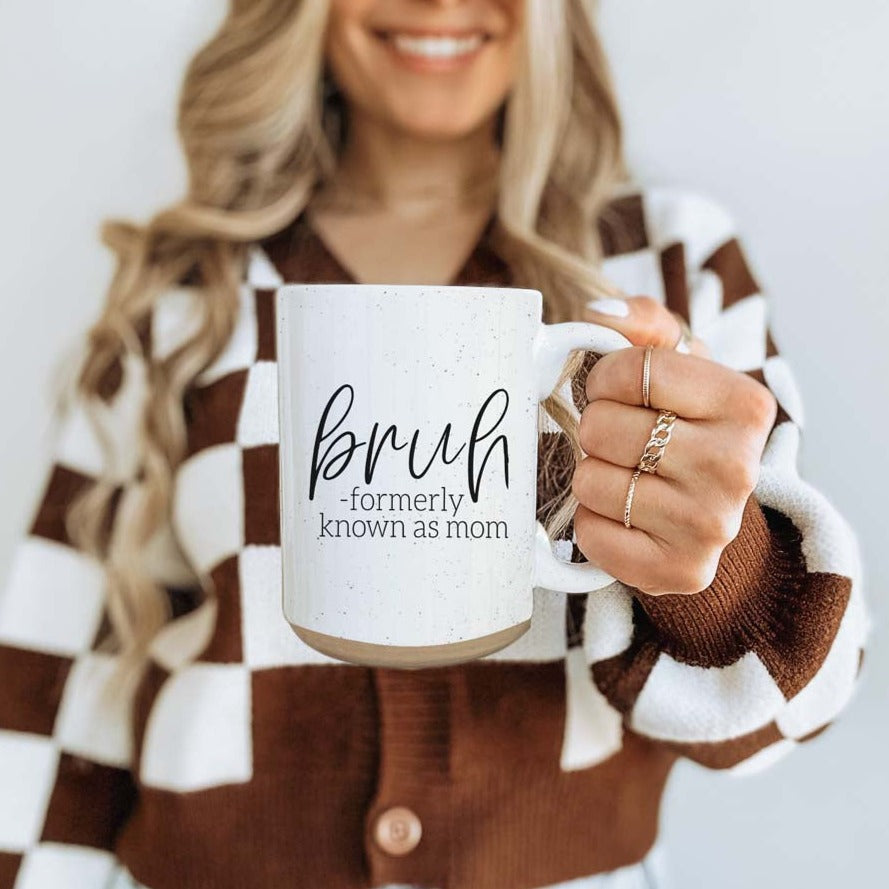 Bruh 16oz ceramic mug with humorous graphic design, off white color with dark speckles, perfect for coffee or tea.