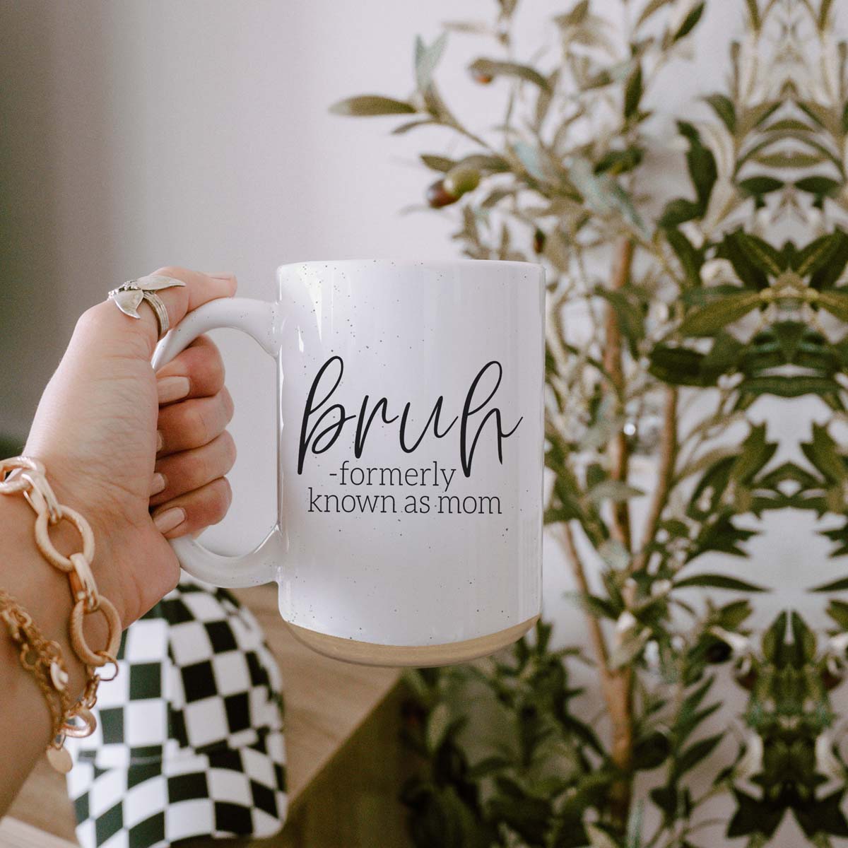 Bruh 16oz ceramic mug with humorous graphic design, off white color with dark speckles, perfect for coffee or tea.