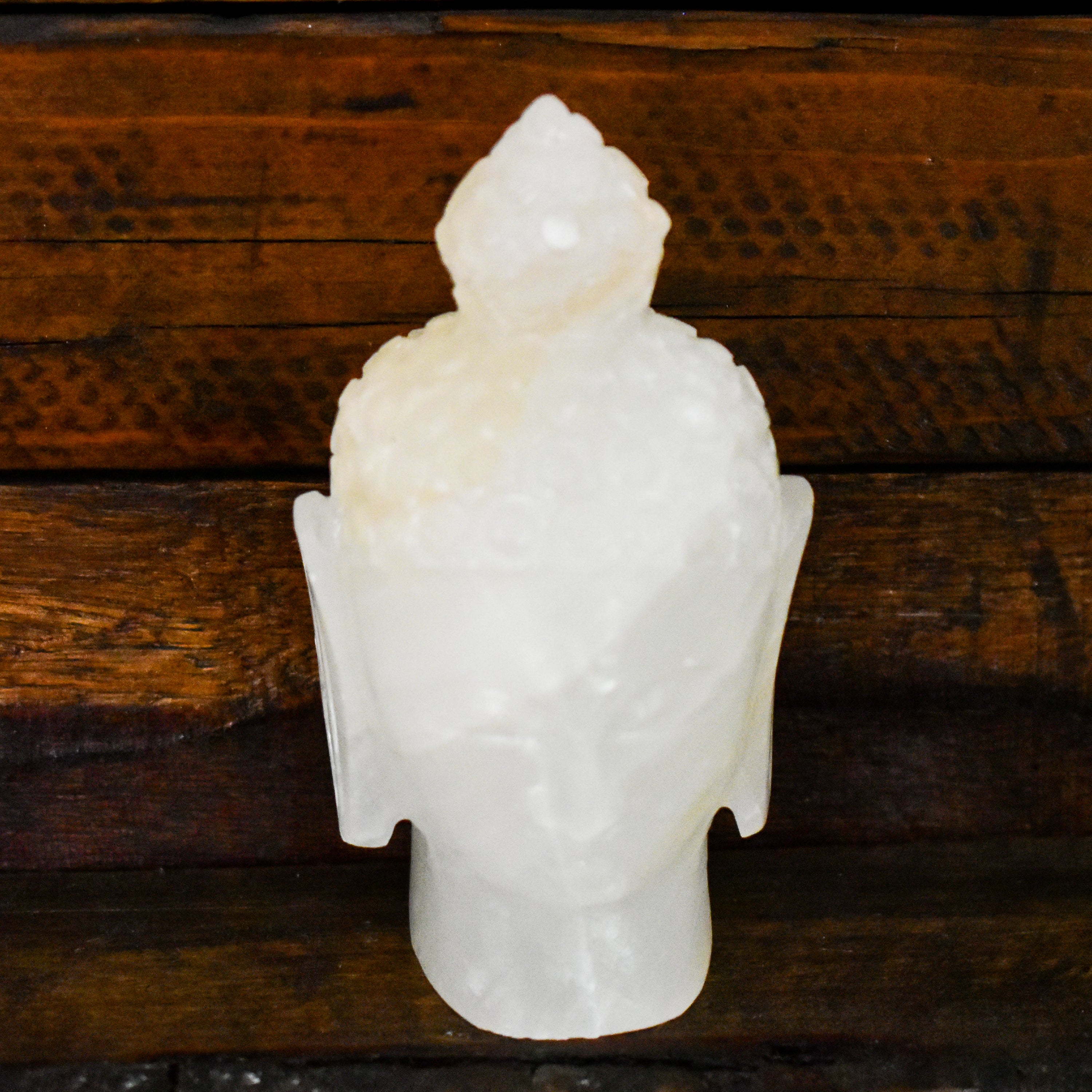 Hand carved Onyx Buddha head decorative accent piece in various colors, showcasing intricate details and craftsmanship.