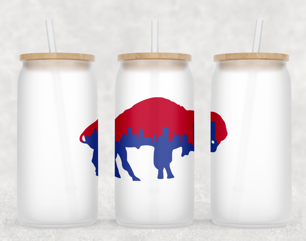 Buffalo Skyline Glass Can Tumbler with bamboo lid and clear straw, showcasing a frosted glass finish.