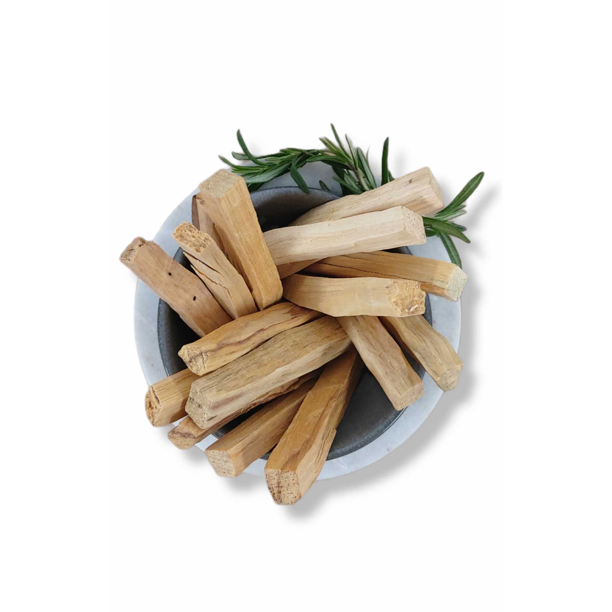 Bulk 1Kg Palo Santo smudge sticks displayed in a natural setting, showcasing their rustic appearance and organic quality.