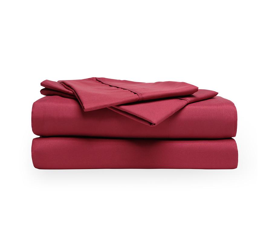 Luxurious Burgundy brushed microfiber sheets set including fitted sheet, flat sheet, and pillowcases, showcasing deep pocket design and soft texture.