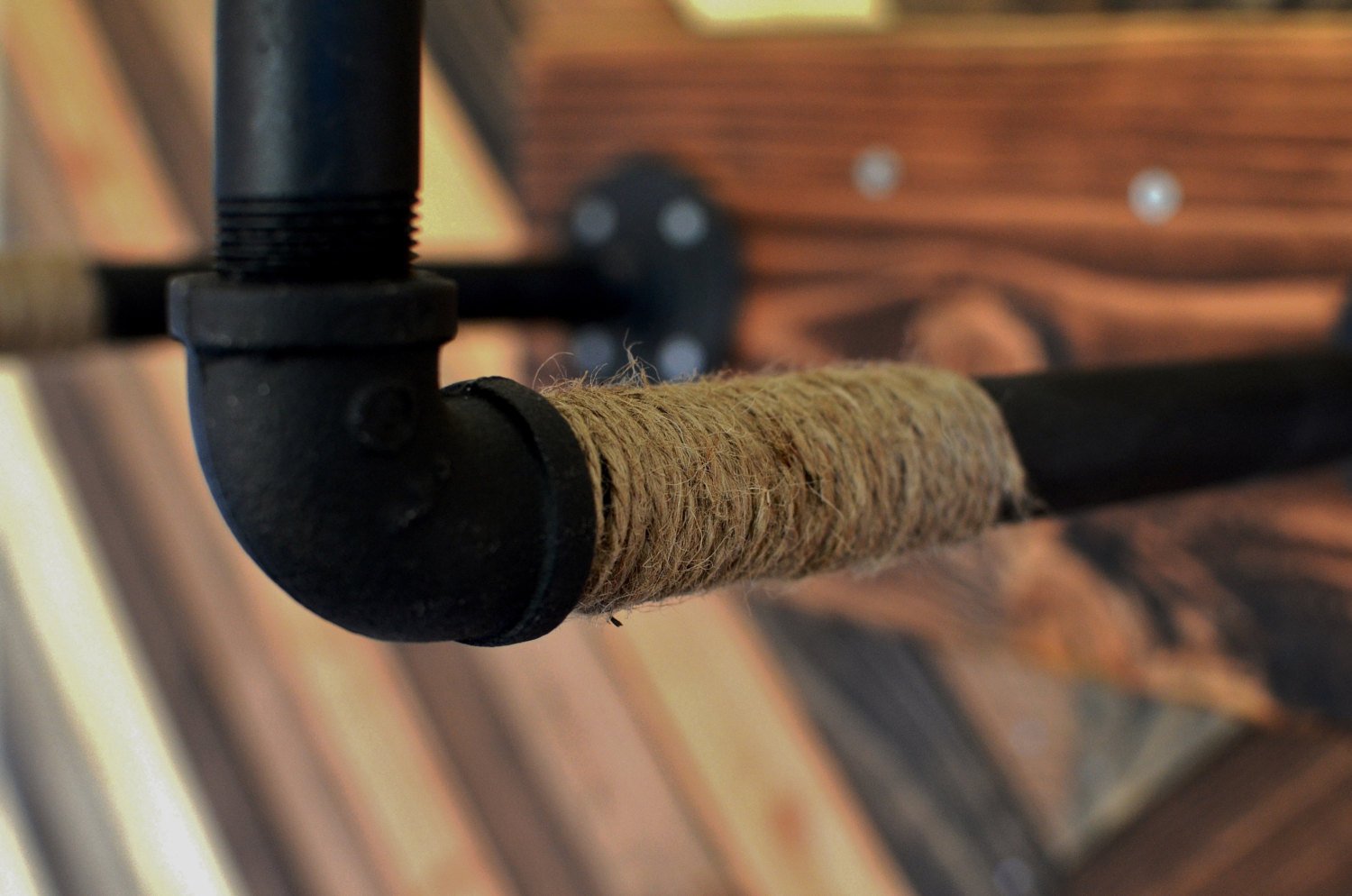 Burlap Iron Pipe Bicycle Wall Display showcasing a bicycle with rustic burlap and sturdy iron pipes.