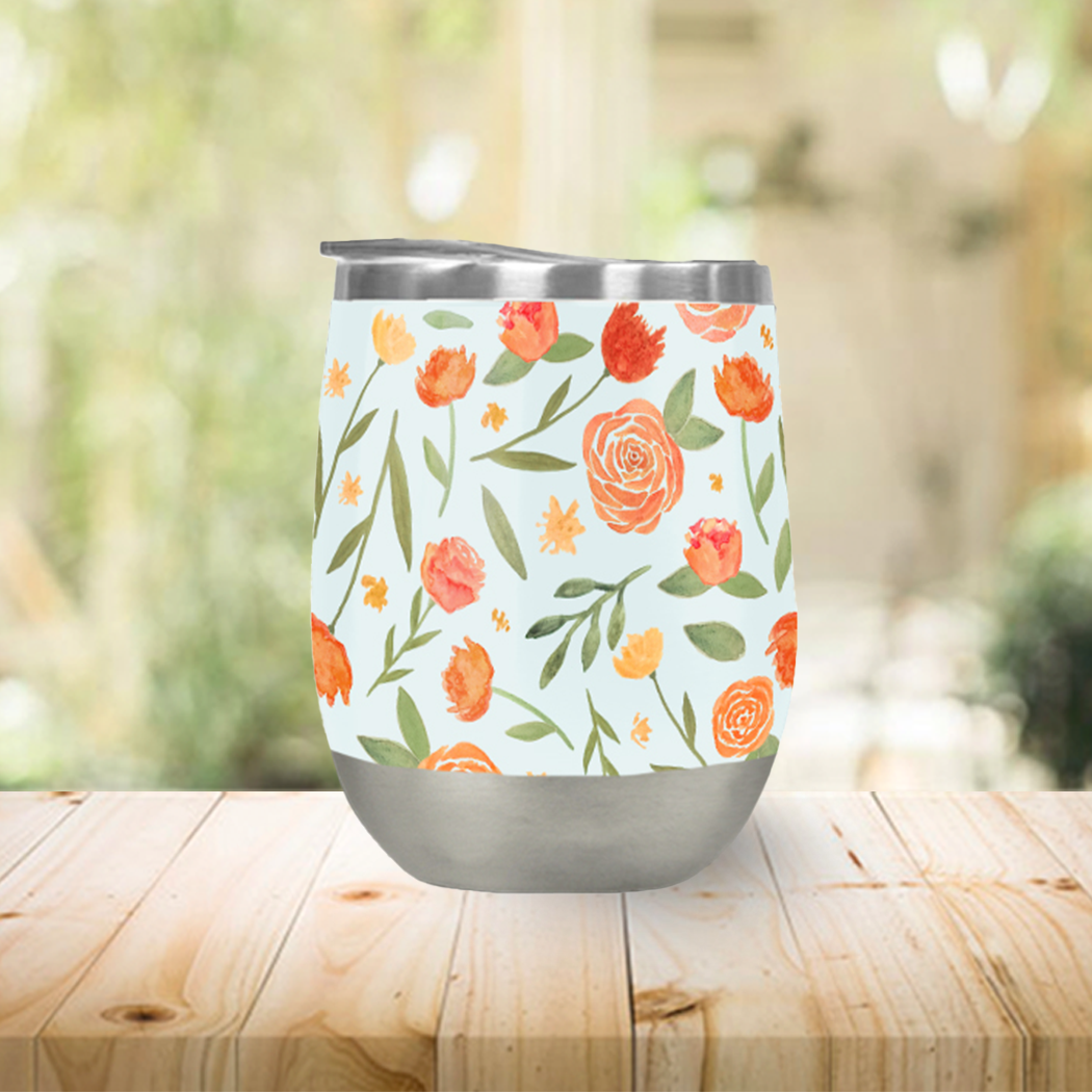 Burnt orange floral wine tumbler with double-wall insulation, perfect for outdoor use.