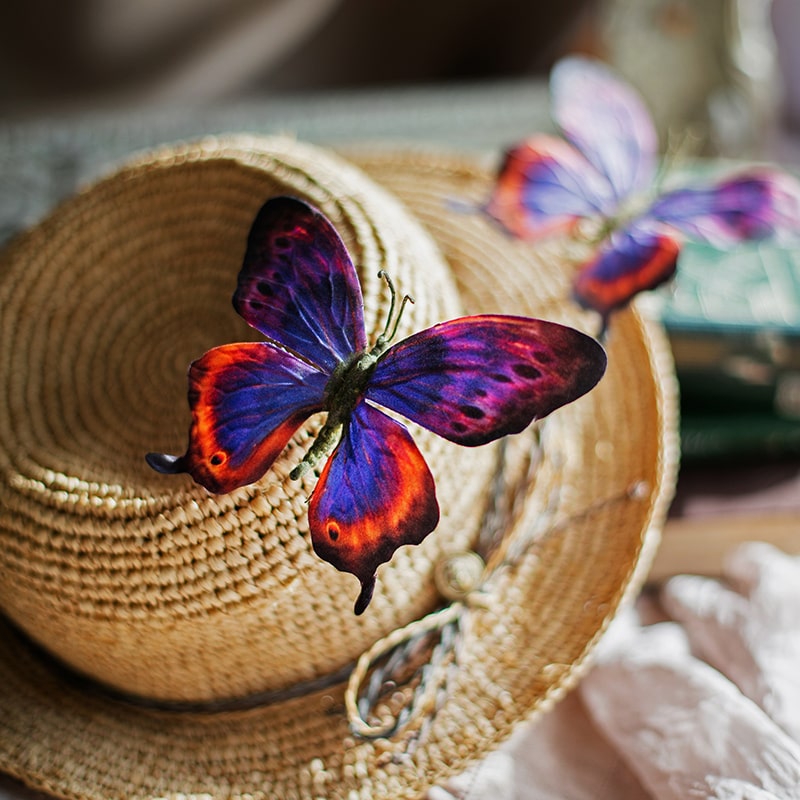 A colorful set of 5 handmade butterfly clips, showcasing various vibrant designs and patterns, perfect for hair accessories.