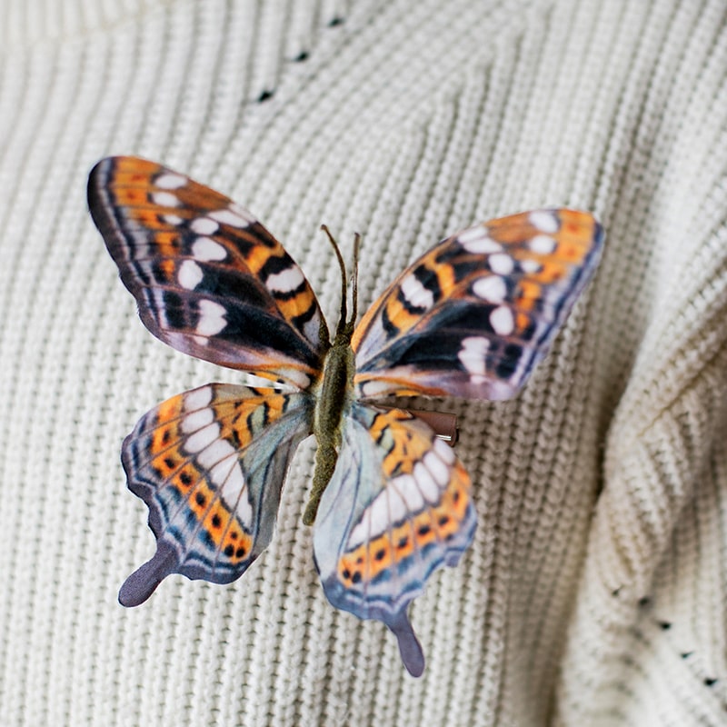 A colorful set of 5 handmade butterfly clips, showcasing various vibrant designs and patterns, perfect for hair accessories.