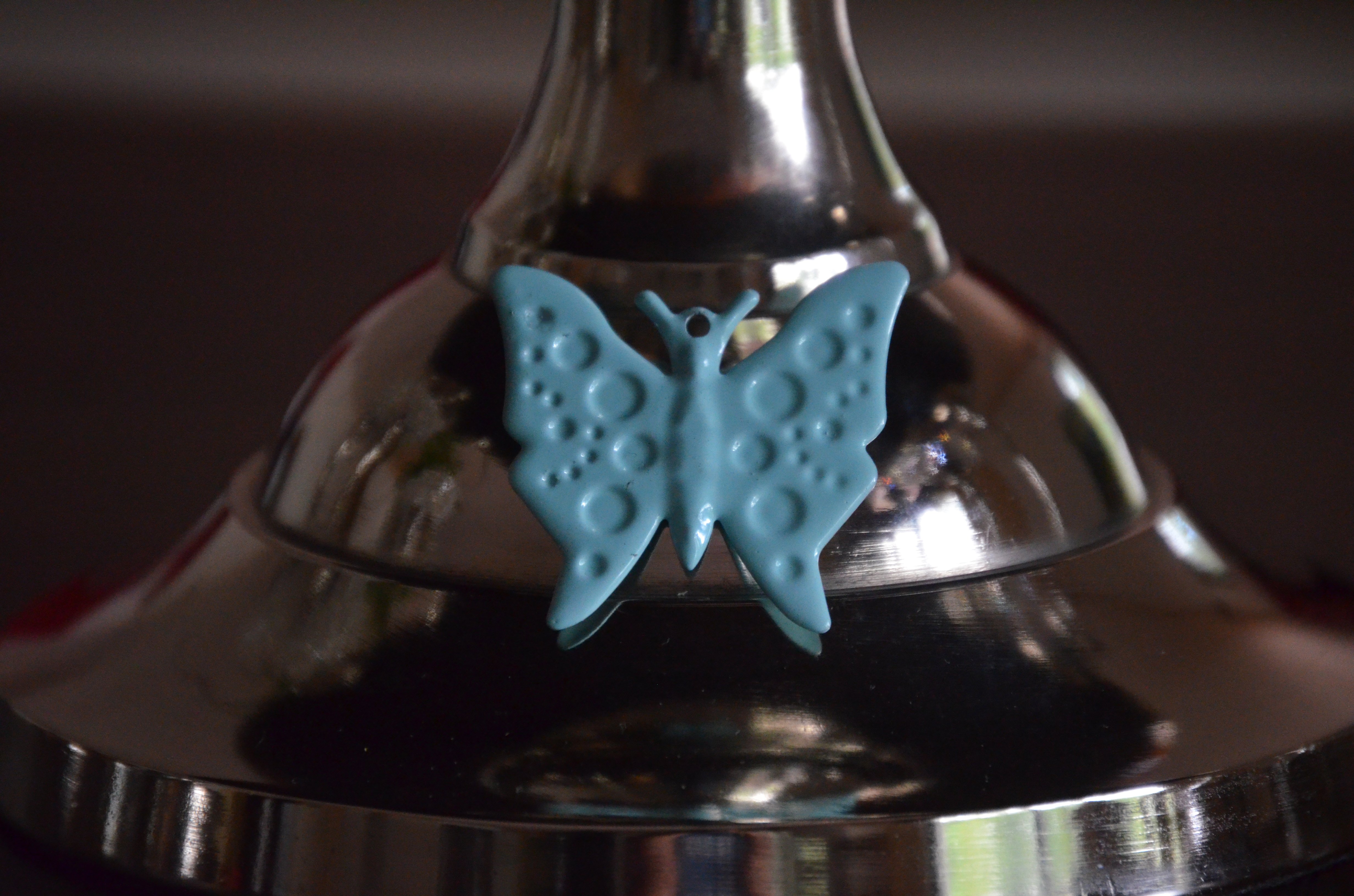 Elegant 10-inch cake stand featuring a turquoise butterfly design, handcrafted from aluminum with a silver finish, perfect for displaying cakes and desserts.