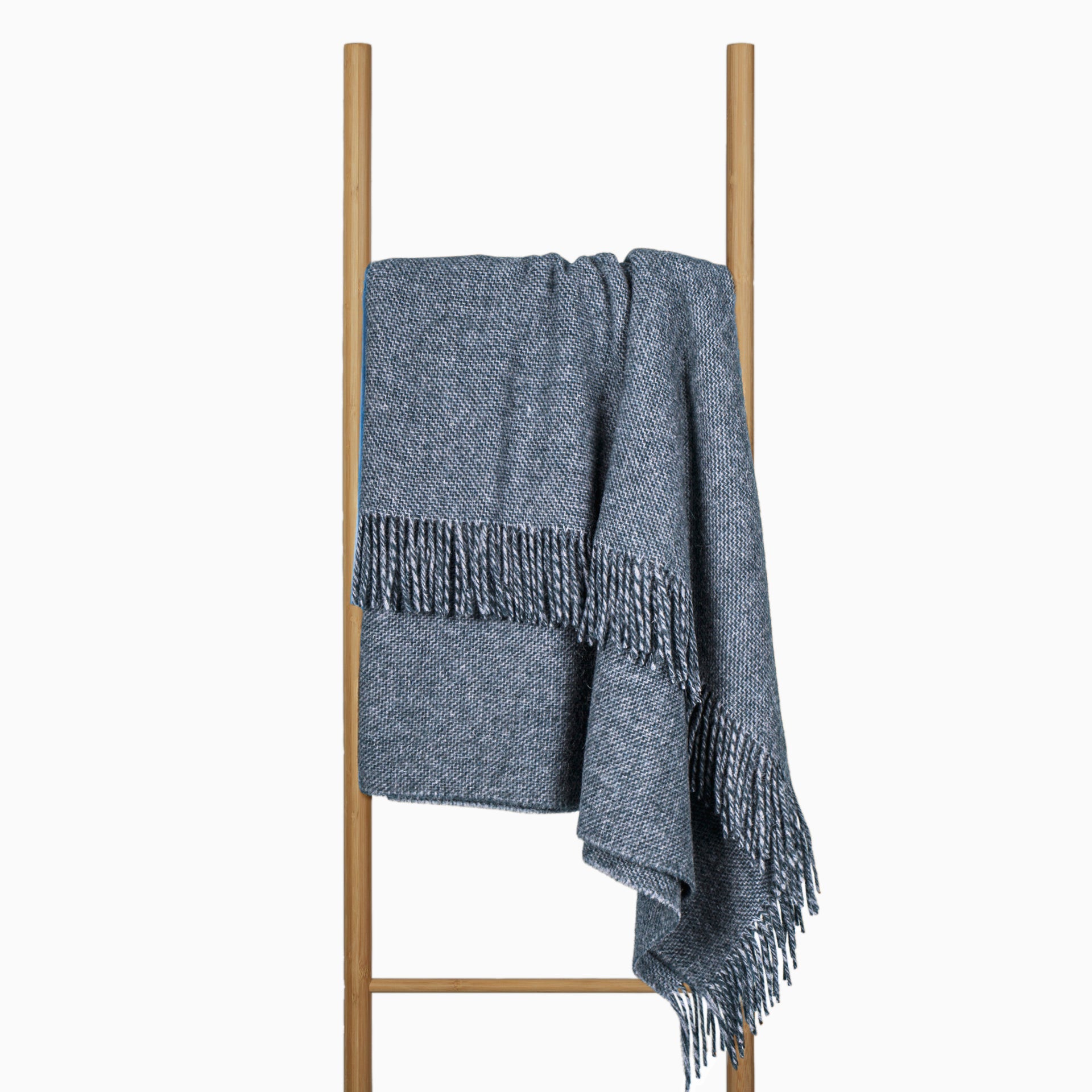 Navy Cambridge Throw blanket made from 100% New Zealand wool, showcasing a thick and cozy texture, perfect for adding warmth and style to any room.