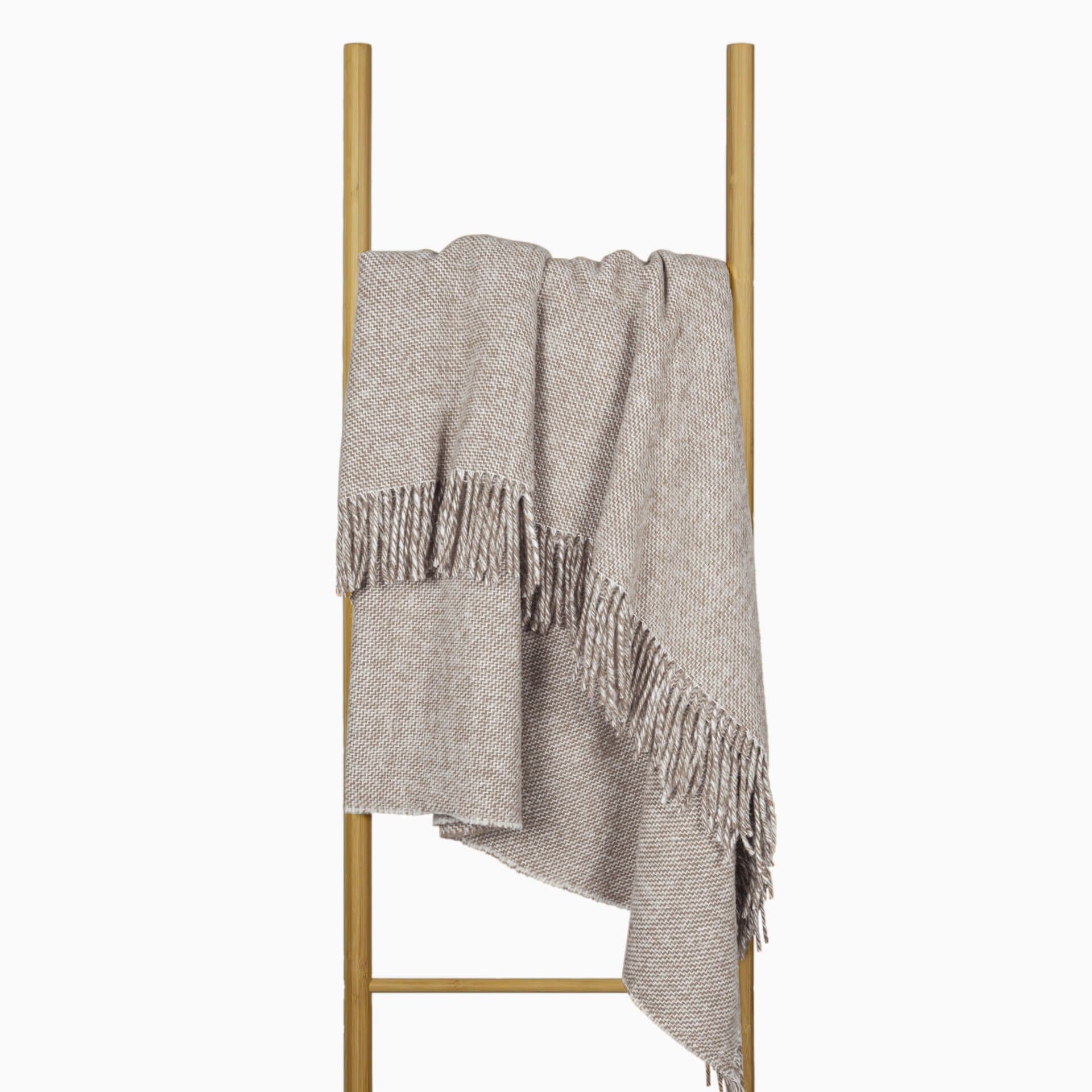 Cambridge Throw blanket made from 100% New Zealand wool in silver color, showcasing its thick and cozy texture.